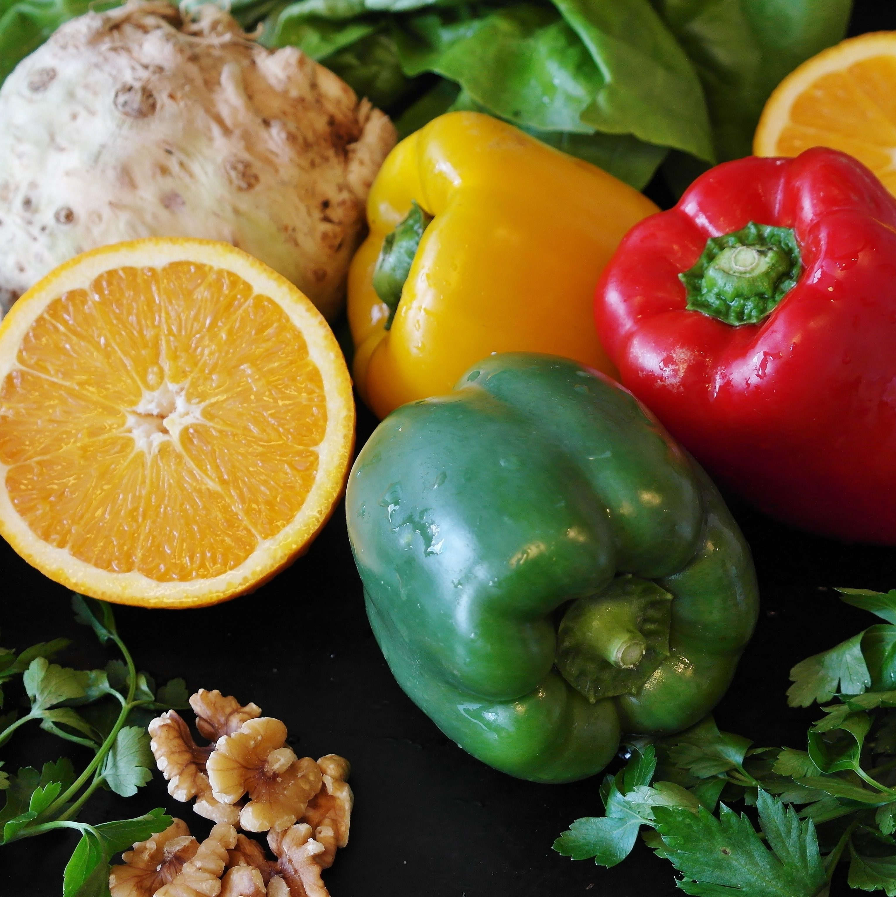 A photograph of fruits and vegetables, all brightly coloured and looking delicious. 